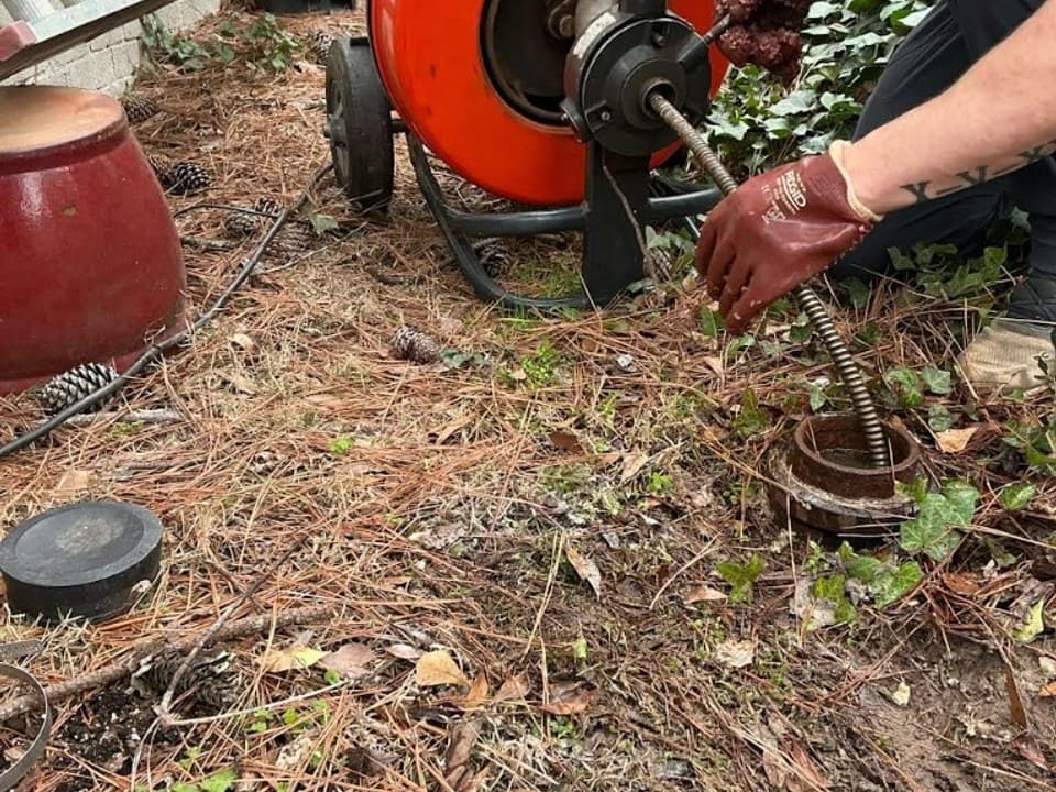 Professional sewer and drain service equipment outside an established Marietta home
